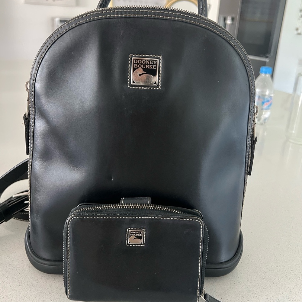 SOLD. Dooney & Bourke Black backpack whit wallet